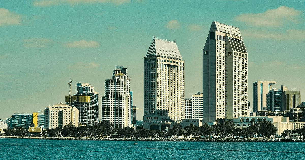 a city skyline with many tall buildings in san diego